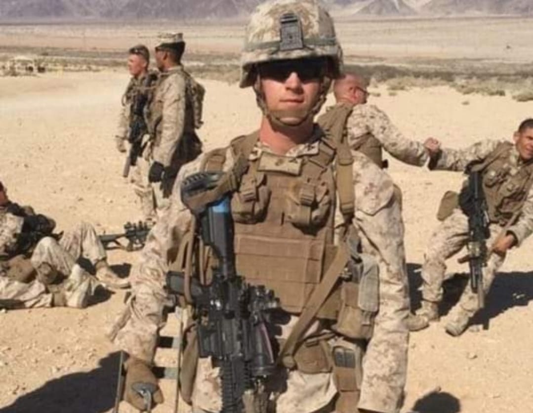Soldiers in desert with tactical gear.